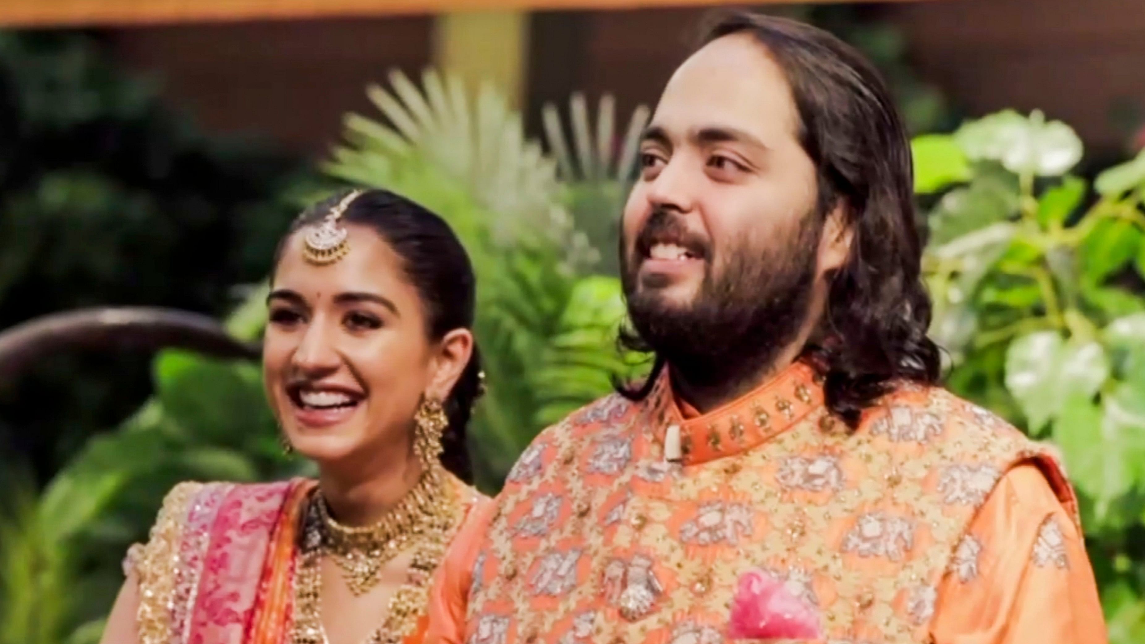 Anant Ambani and Radhika Merchant during a ceremony ahead of their wedding, at Antilia, in Mumbai.