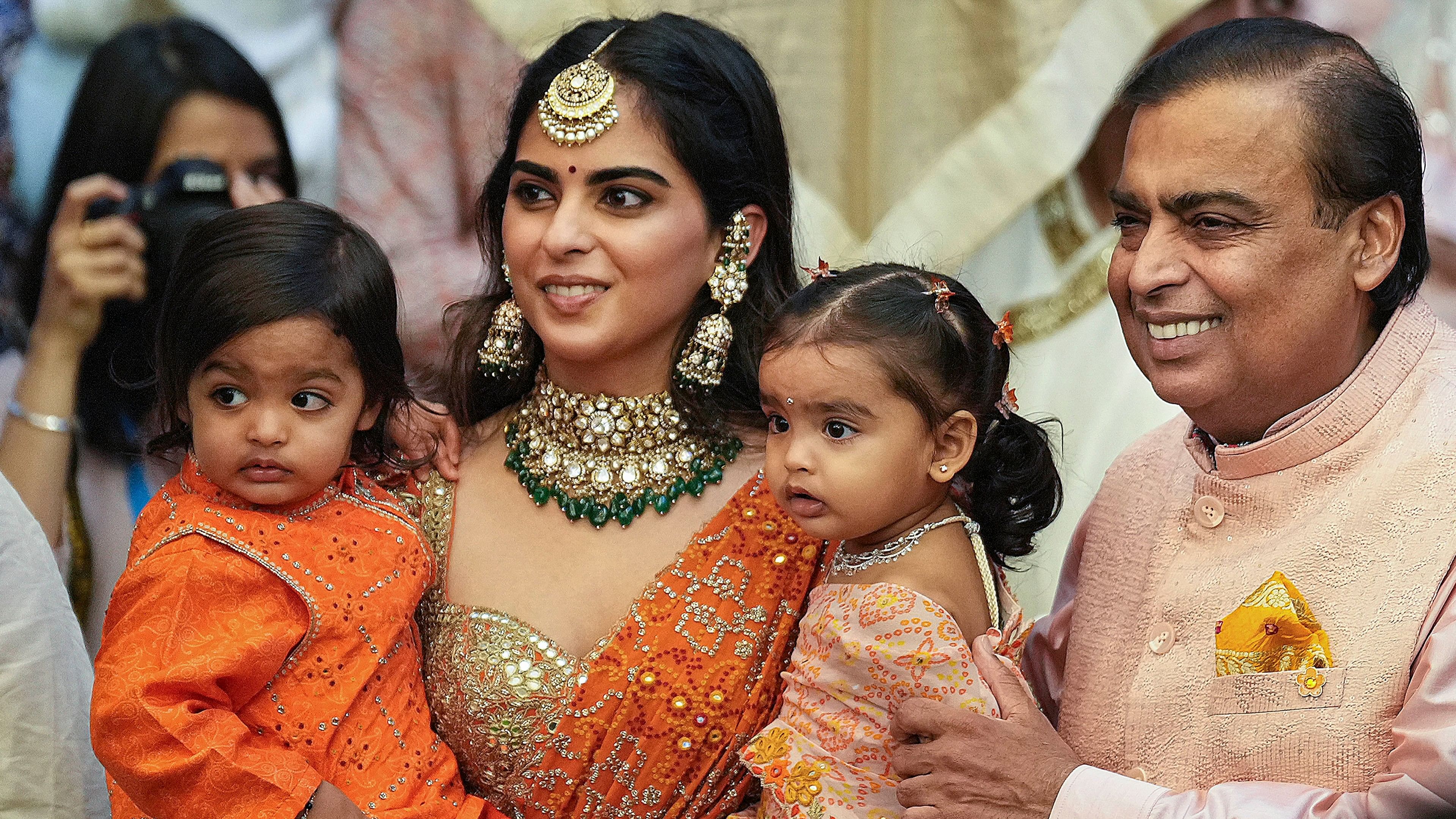 Reliance Industries Chairman Mukesh Ambani with daughter Isha Ambani and grandchildren during a pre-wedding ceremony ahead of the wedding of his son Anant Ambani and Radhika Merchant, at Antilia, in Mumbai.