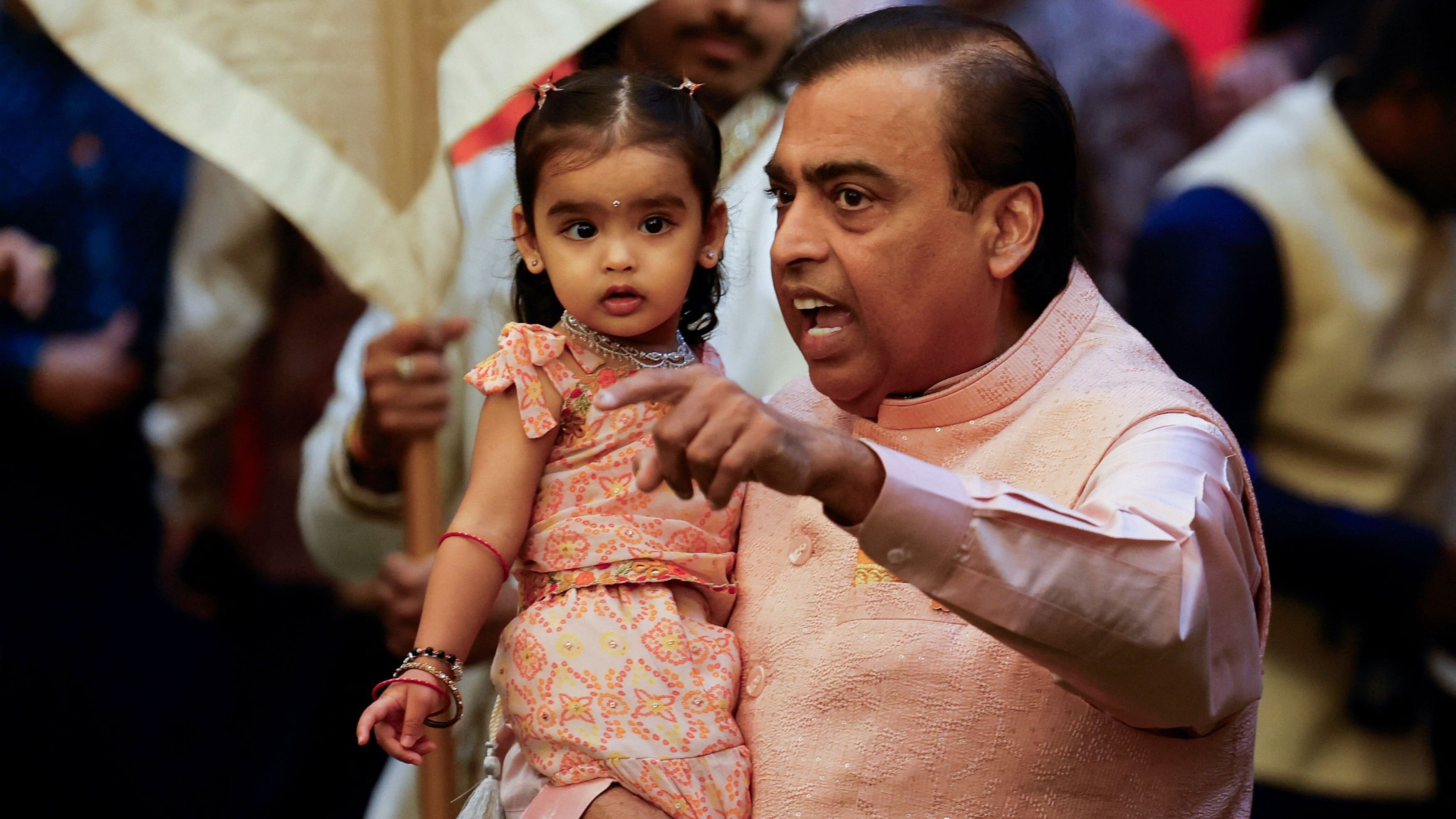 Mukesh Ambani and granddaughter Aadiya during the pre-wedding ceremony of Anant Ambani and Radhika Merchant, at his residence in Mumbai.