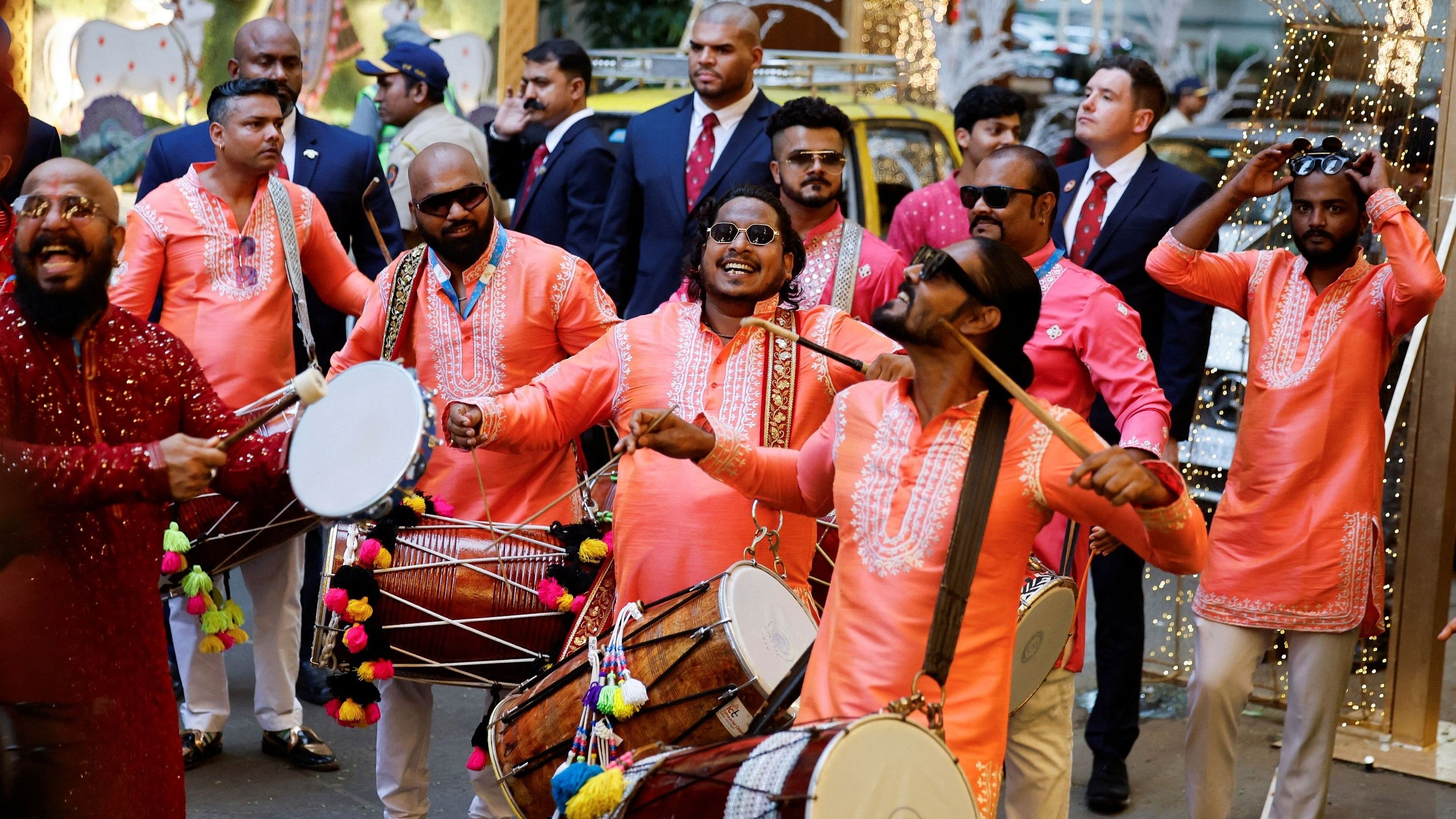 A band plays drums during the pre-wedding ceremony of Anant Ambani and Radhika Merchant outside the residence of Mukesh Ambani, in Mumbai.