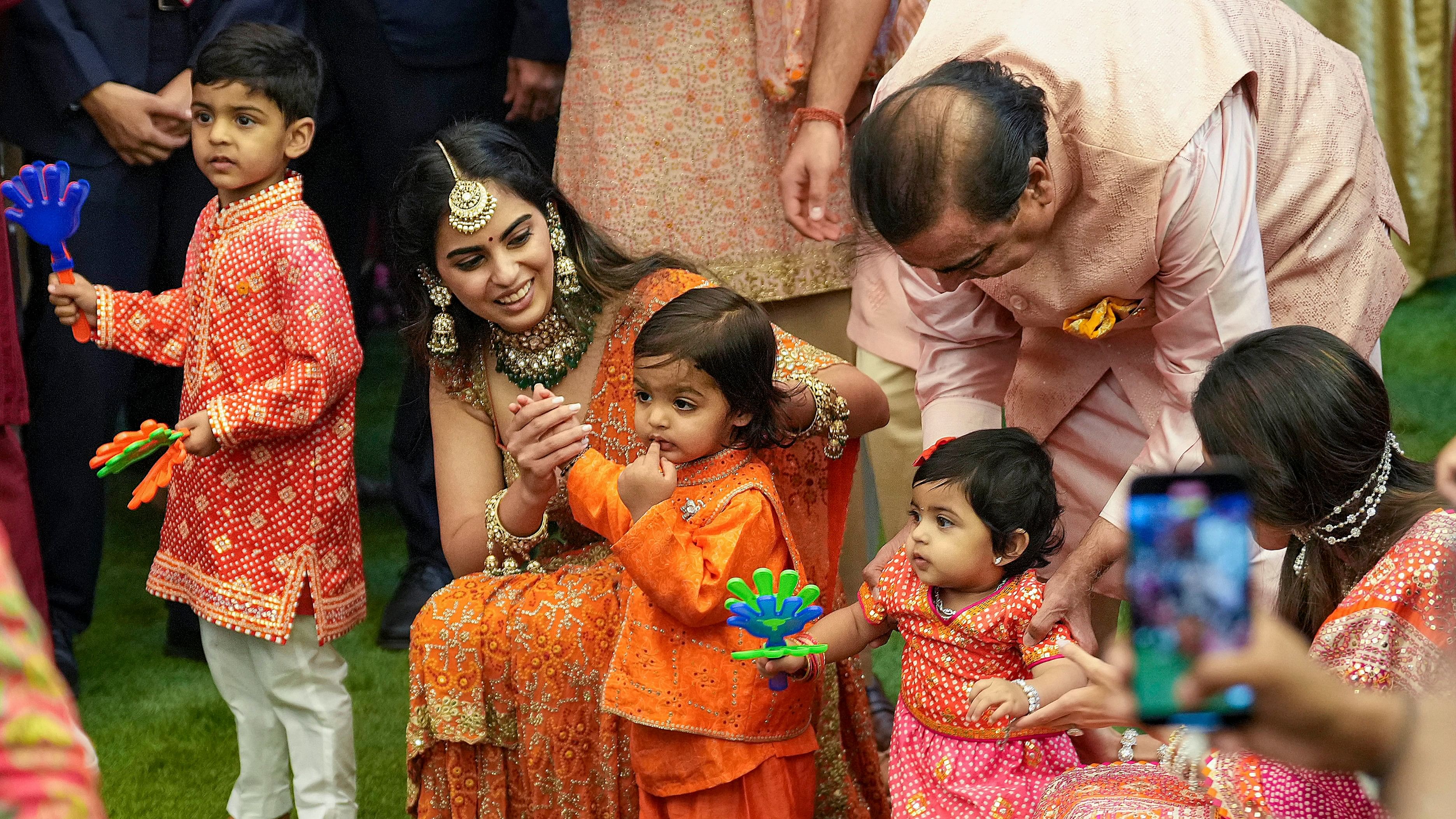 Reliance Industries Chairman Mukesh Ambani with daughter Isha Ambani and grandchildren during the pre-wedding ceremony ahead of the wedding of his son Anant Ambani and Radhika Merchant, at Antilia, in Mumbai.