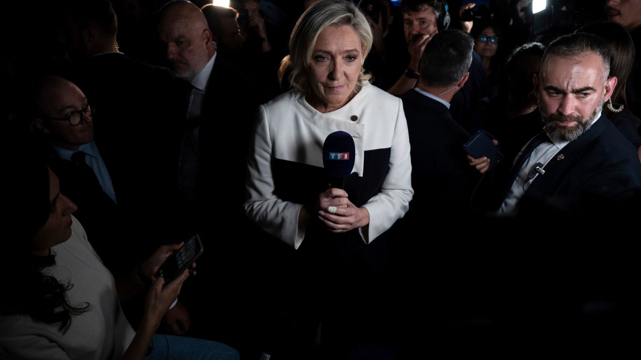 Far-right National Rally party leader Marine Le Pen speaks to reporters in Paris after partial results showed her party would not clinch the majority. 