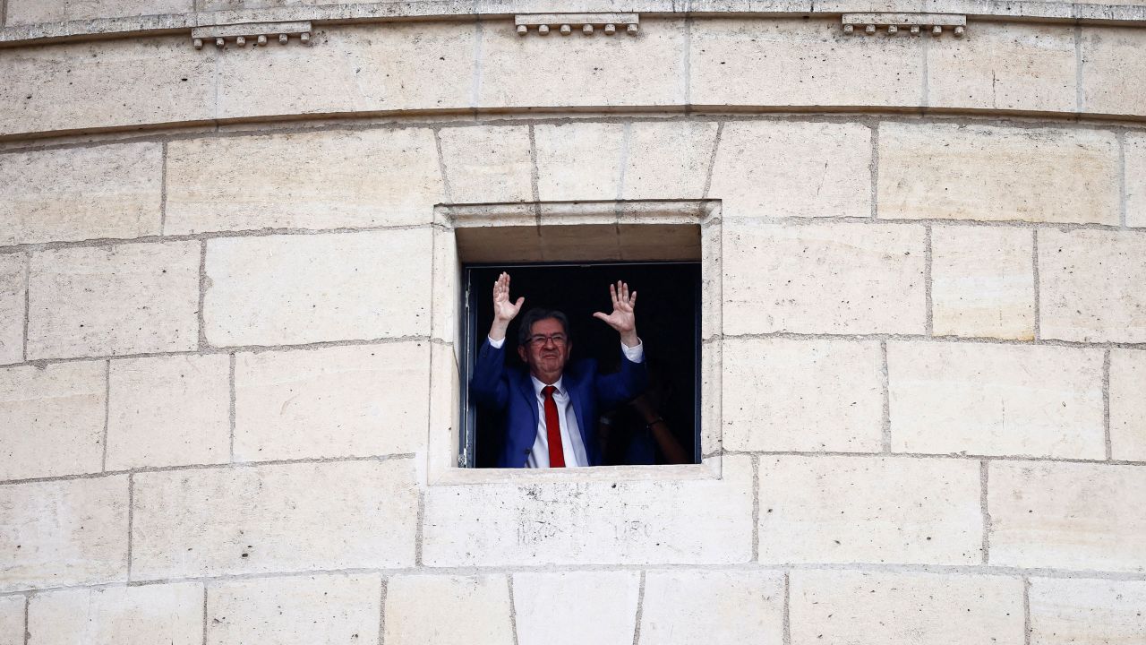 Jean-Luc Mélenchon, leader of the France Unbowed party and member of the New Popular Front, waves to supporters in Paris after partial results were released. 