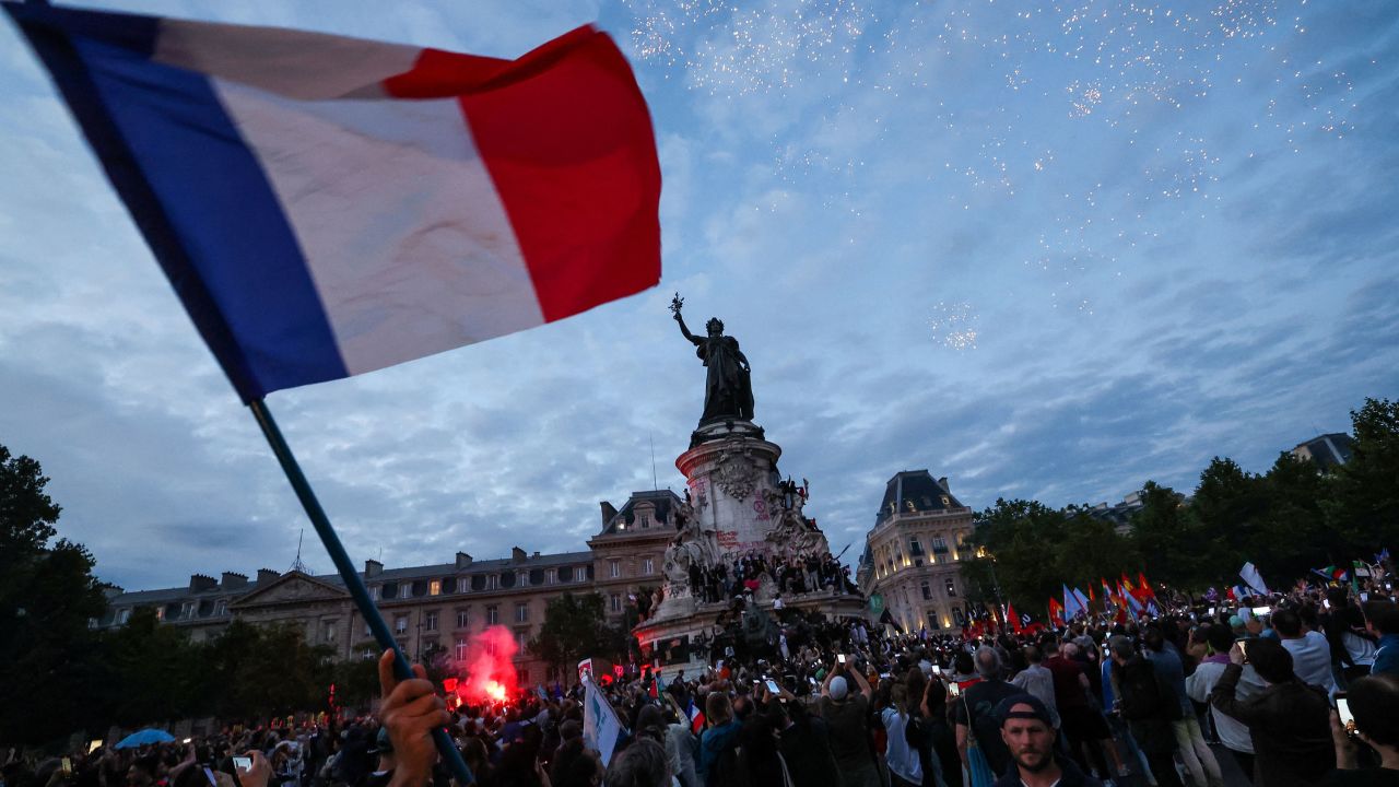 Crowds gather during an election night rally at Place de la République in Paris. 