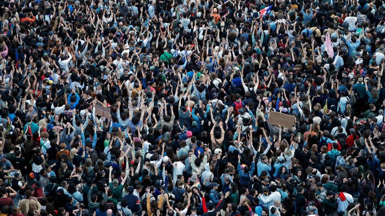 People gather at Place de la République in Paris to celebrate the early results. 