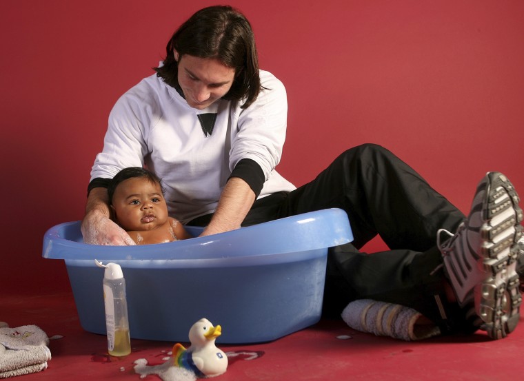 Lionel Messi bathing Lamine Yamal during a photo shoot in Barcelona, Spain