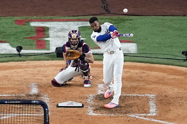 Dodgers outfielder Teoscar Hernández hits a home run during the...