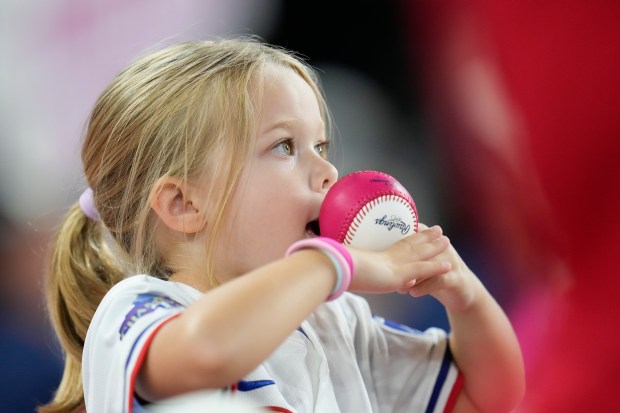 A young fan watches during the All-Star Home Run Derby,...