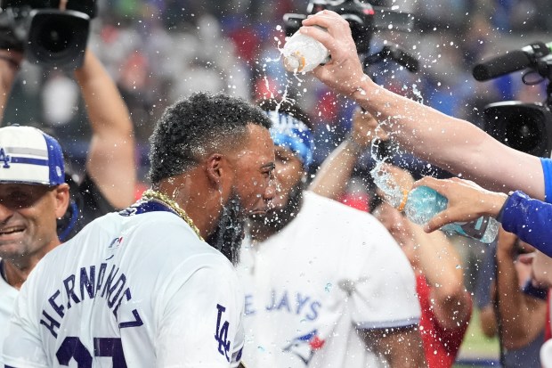 Dodgers outfielder Teoscar Hernández celebrates after winning the All-Star Home...