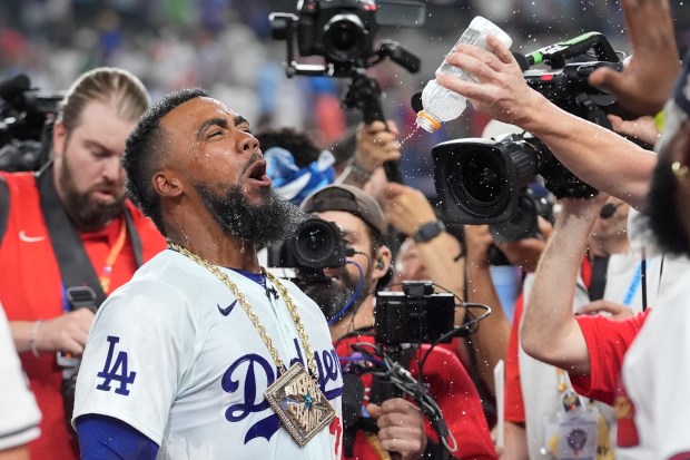 Dodgers outfielder Teoscar Hernández celebrates after winning the All-Star Home...