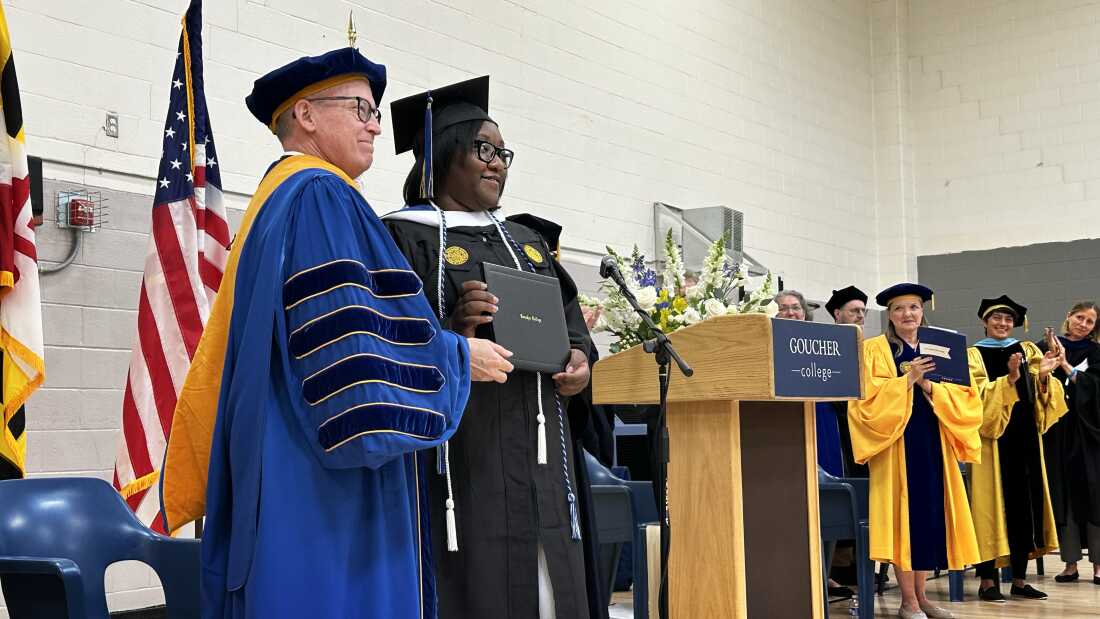 Janet Johnson receives her college diploma from Kent Devereaux, President of Goucher College.