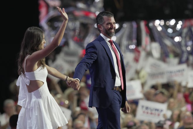 Kai Trump walks out with her father Donald Trump Jr. during the third day of the Republican National Convention at Fiserv Forum. The third day of the RNC focused on foreign policy and threats.