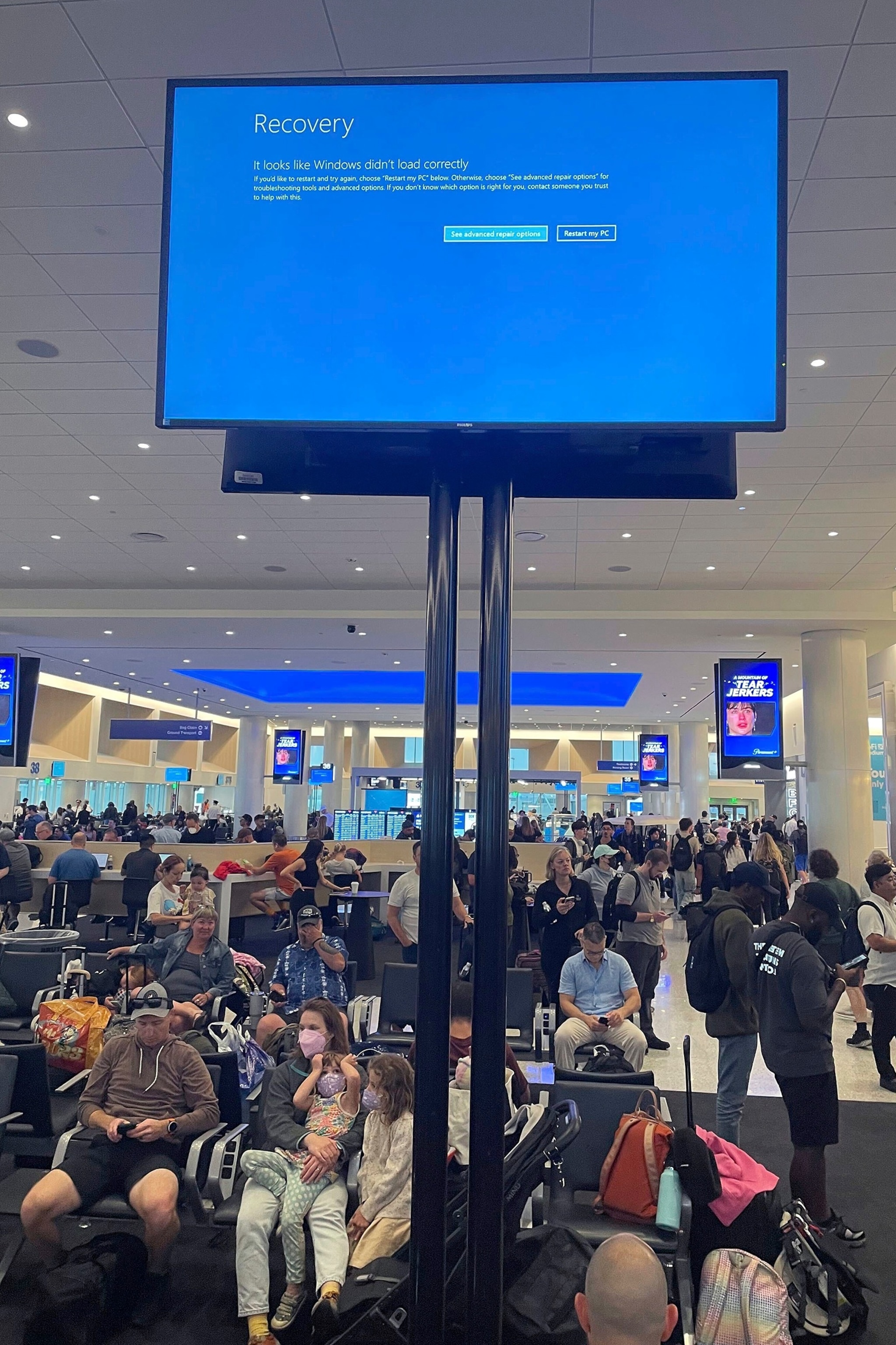 PHOTO: Travelers wait during an outage at  Los Angeles International Airport on July 19, 2024 in Los Angeles.