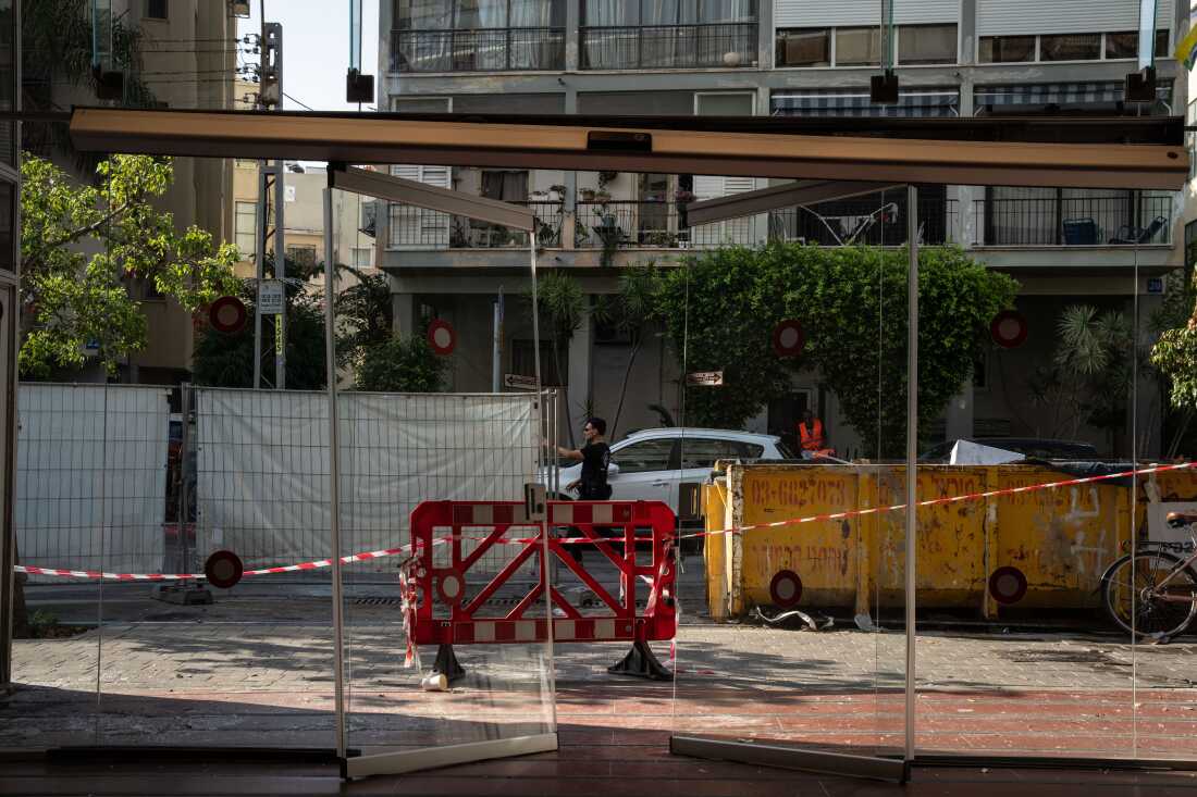 Israeli policemen search the scene of an explosion on July 19.