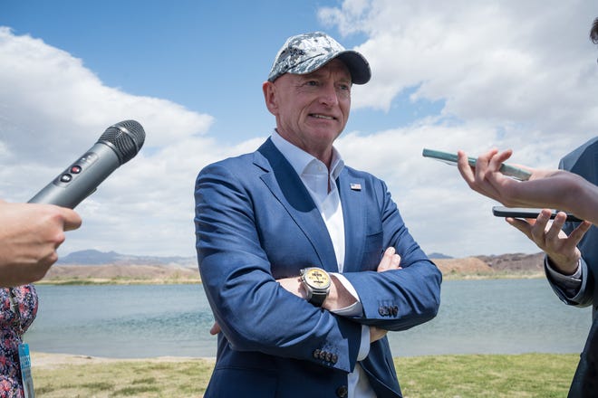 Senator Mark Kelly answers questions from the media after the signing of the Colorado River Indian Tribes water rights agreement at the BlueWater Resort on April 26, 2024 in Parker, Ariz.