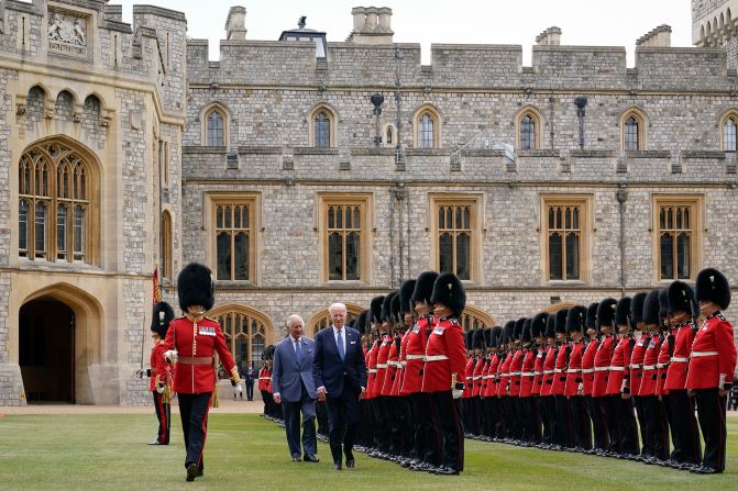 Biden reviews royal guards in front of Britain's King Charles III during a <a href=