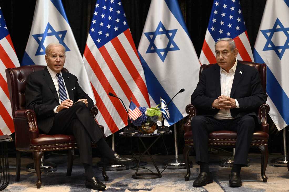 US President Joe Biden (L) listens to Israel's Prime Minister Benjamin Netanyahu as he joins a meeting of the Israeli war cabinet in Tel Aviv on October 18 amid the ongoing battles between Israel and the Palestinian group Hamas. US President Joe Biden landed in Tel Aviv on October 18, 2023 as Middle East anger flared after hundreds were killed when a rocket struck a hospital in war-torn Gaza, with Israel and the Palestinians quick to trade blame. (Photo by Brendan SMIALOWSKI / AFP) (Photo by BRENDAN SMIALOWSKI/AFP via Getty Images)