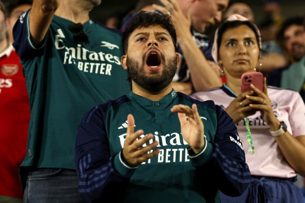 A fan yells during the second half of a preseason...