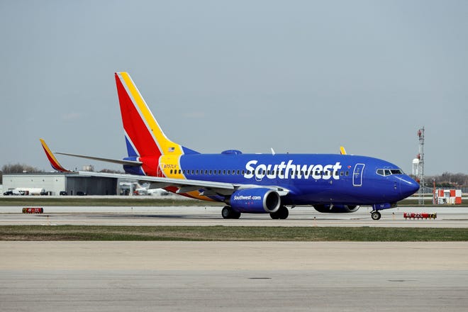 A Southwest Airlines Boeing 737-7H4 jet taxis to the gate after landing at Midway International Airport in Chicago, Illinois, on April 6, 2021. (Photo by KAMIL KRZACZYNSKI / AFP) (Photo by KAMIL KRZACZYNSKI/AFP via Getty Images)