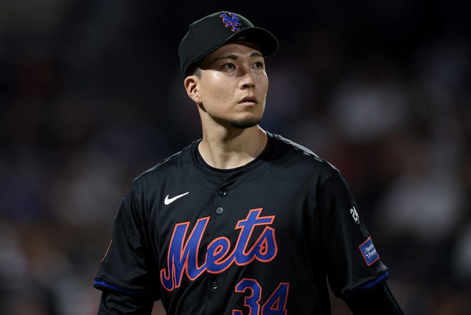 New York Mets starting pitcher Kodai Senga (34) looks back at the main scoreboard during the fourth inning against the Atlanta Braves on July 26, 2024, at Citi Field.