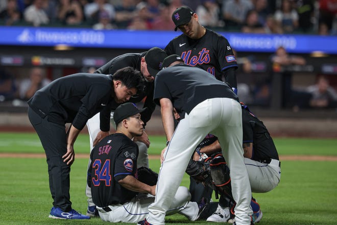 New York Mets starting pitcher Kodai Senga (34) on the field after an injury during the fifth inning against the Atlanta Braves on July 26, 2024, at Citi Field.