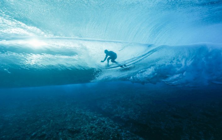 France's Joan Duru gets into the barrel during the first round of the surfing competition on July 27. The surfing events are <a href=