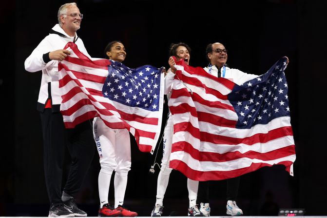 US fencers Lauren Scruggs, center left, and Lee Kiefer celebrate after facing off in the foil final on July 28. <a href=