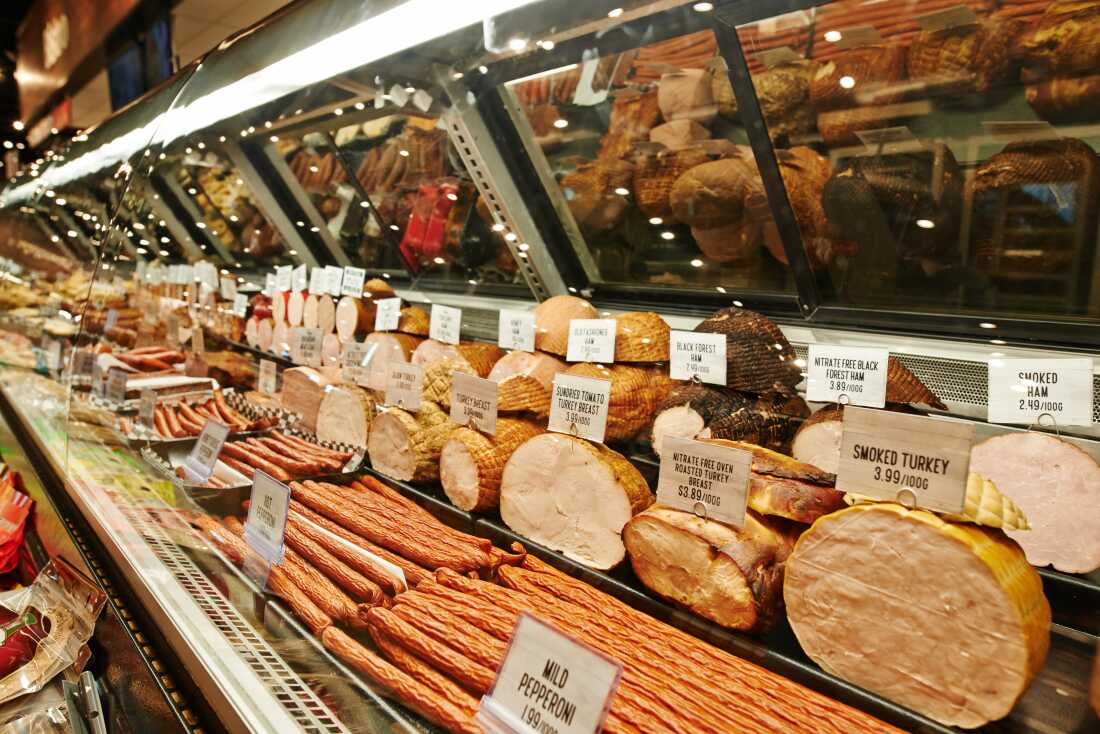 At least two people have died and more than a dozen have been hospitalized in connection with a listeria outbreak linked to meat sold at deli counters, the Centers for Disease Control and Prevention said.