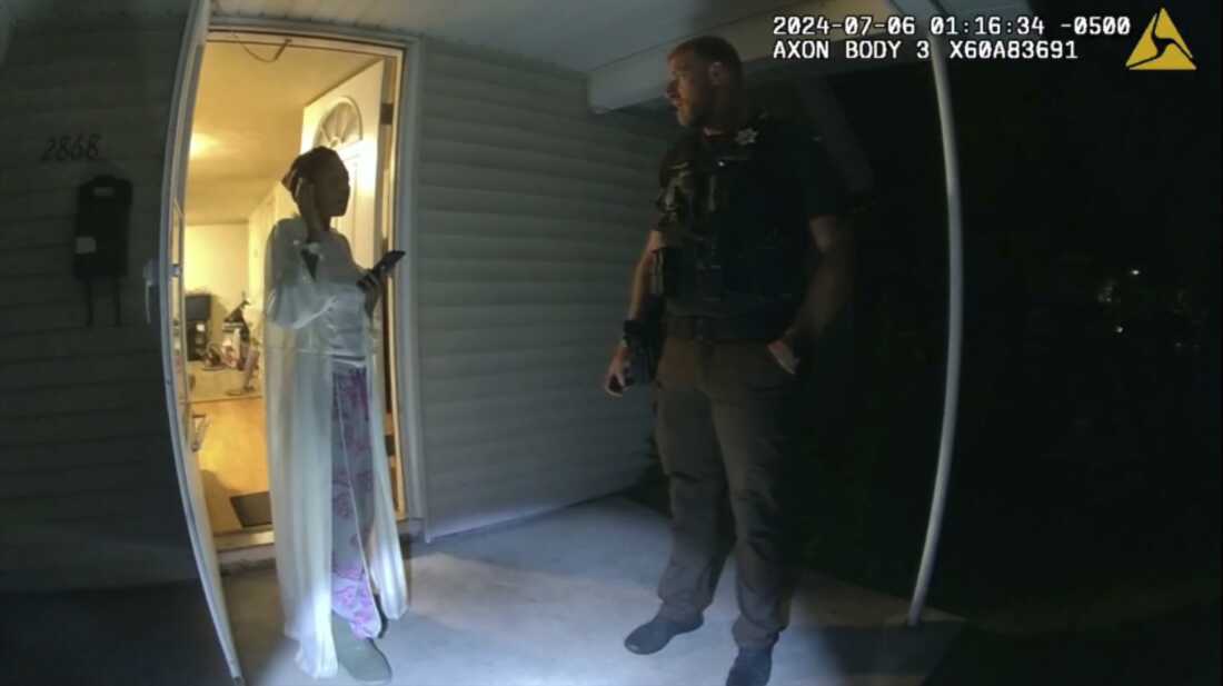 In this image taken from body camera video released by Illinois State Police, Sonya Massey, left, talks with former Sangamon County Sheriff’s Deputy Sean Grayson outside her home in Springfield, Ill., July 6, 2024.  