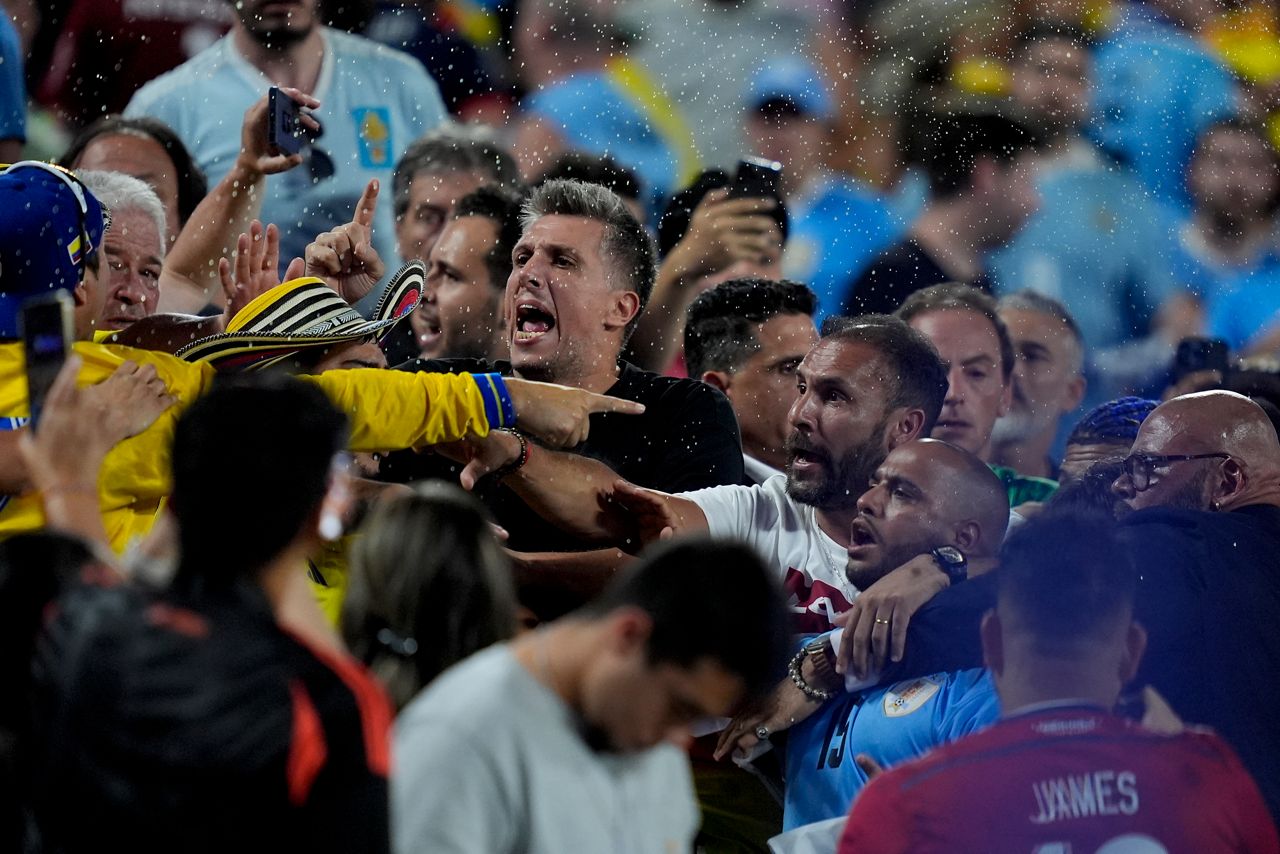 Uruguay's players argue with fans at the end of a Copa America semifinal soccer match against Colombia in Charlotte, N.C., Wednesday, July 10, 2024. (AP Photo/Julia Nikhinson)