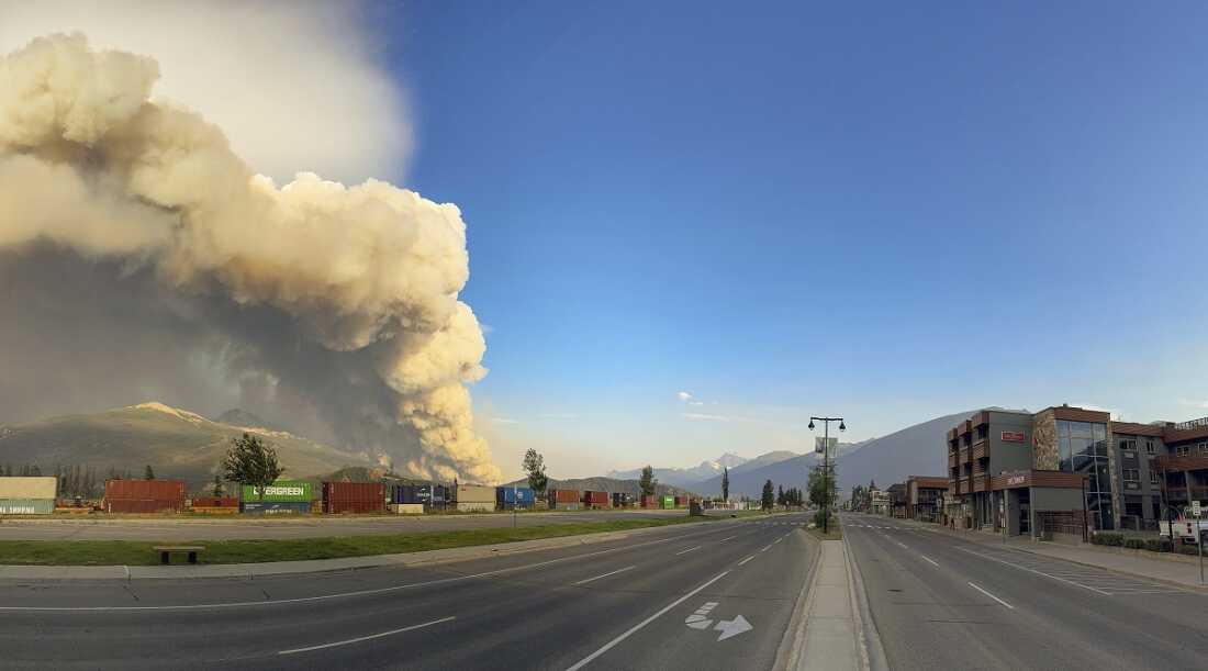 In this photo released by the Jasper National Park, smoke rises from a wildfire burning near Jasper, Alberta, Canada, on Wednesday.