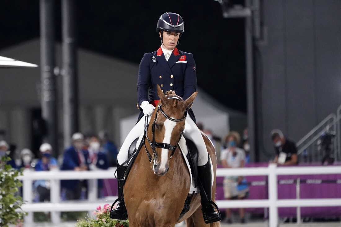 Britain's Charlotte Dujardin competes in the equestrian dressage individual final at the 2020 Summer Olympics, on July 28, 2021, in Tokyo. Dujardin of Great Britain has withdrawn from the Paris Games after a video emerged that she says shows her behaving inappropriately while coaching other riders.