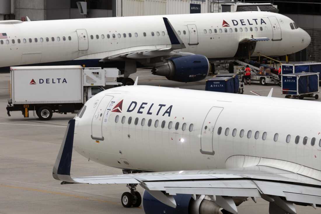 U.S. airline regulators have opened an investigation into Delta Air Lines, which is still struggling to restore operations on Tuesday, more than four full days after a faulty software update caused technological havoc worldwide and disrupted global air travel. Here, a Delta Air Lines plane leaves the gate on July 12, 2021, at Logan International Airport in Boston.