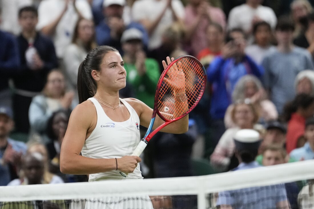 Emma Navarro of the United States celebrates after defeating compatriot Coco Gauff in their fourth round match at the Wimbledon tennis championships in London, Sunday, July 7, 2024. (AP Photo/Alberto Pezzali)