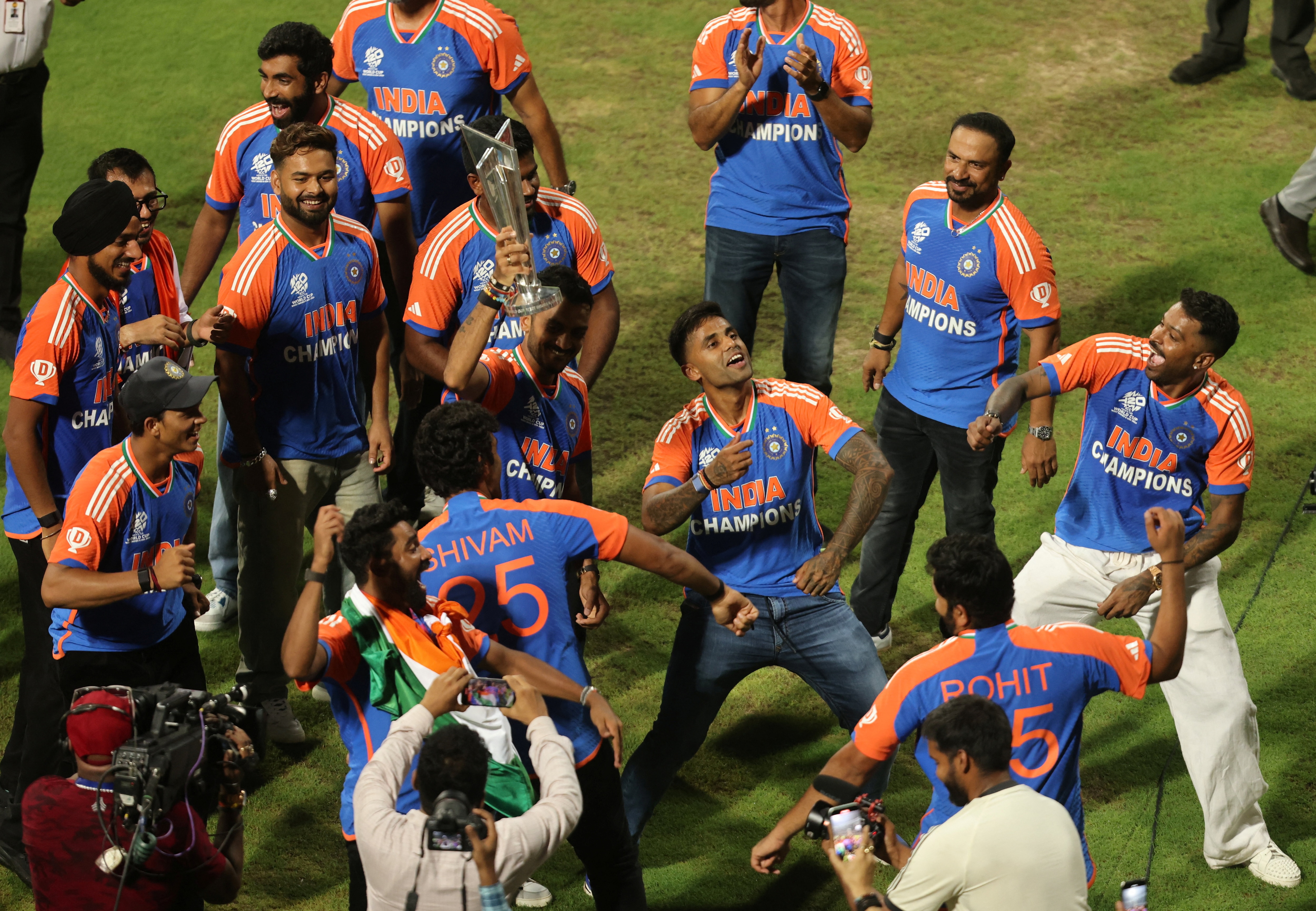 Indian team cricketers dance during a victory lap to celebrate winning the ICC Men's T20 World Cup, at Wankhede stadium in Mumbai, India, July 4, 2024. (Image: Reuters)