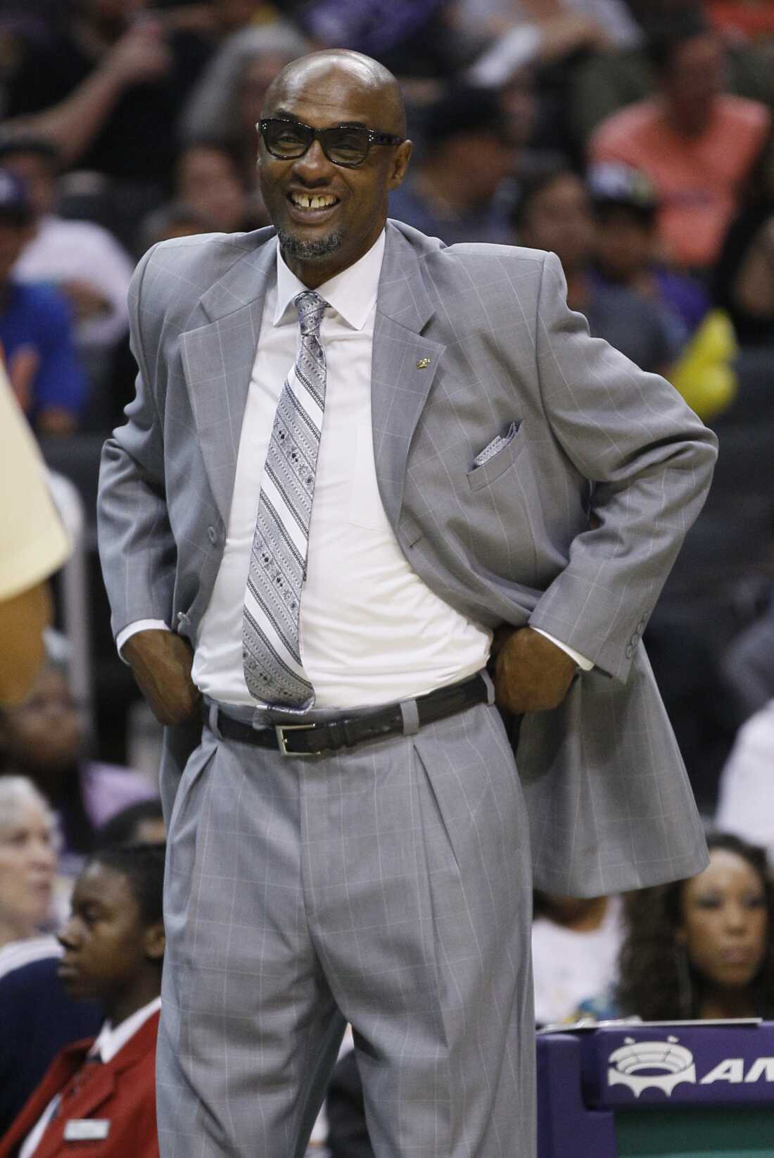 Los Angeles Sparks head coach Joe Bryant smiles at a referee during the second half of a WNBA basketball game against the Chicago Sky in Los Angeles on Sept. 10, 2011. The Sparks won 74-67.