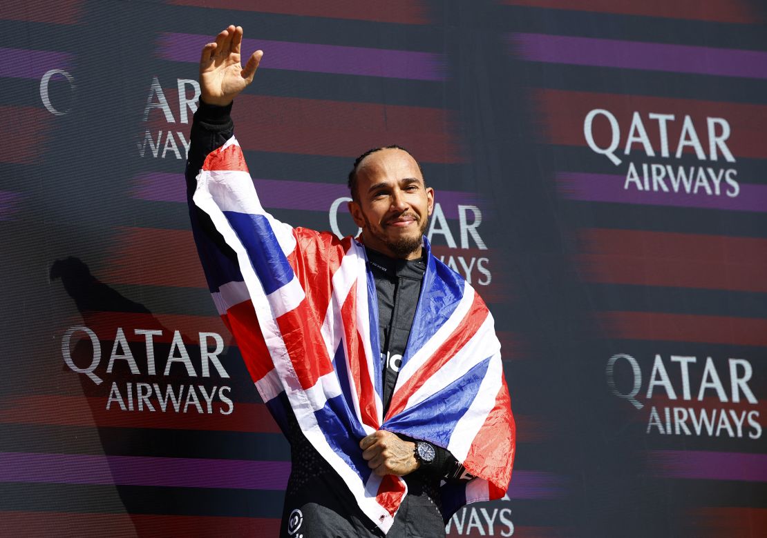 Lewis Hamilton celebrates on the podium after winning the British Grand Prix.