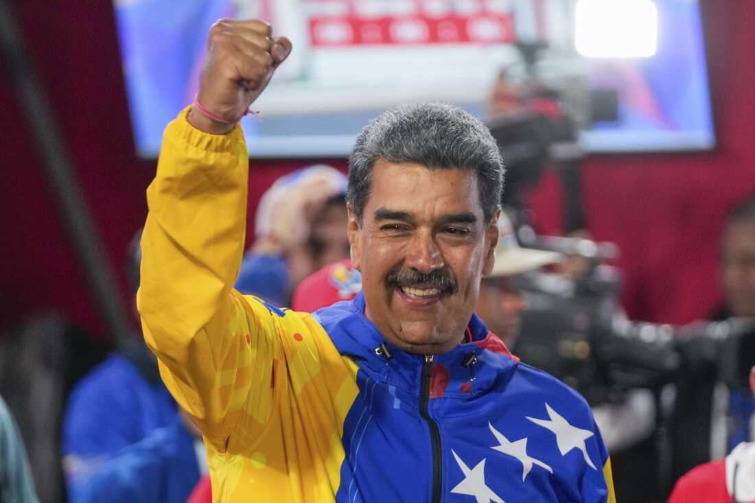 President Nicolas Maduro addresses supporters after electoral authorities declared him the winner of the presidential election in Caracas, Venezuela, Monday, July 29, 2024. 