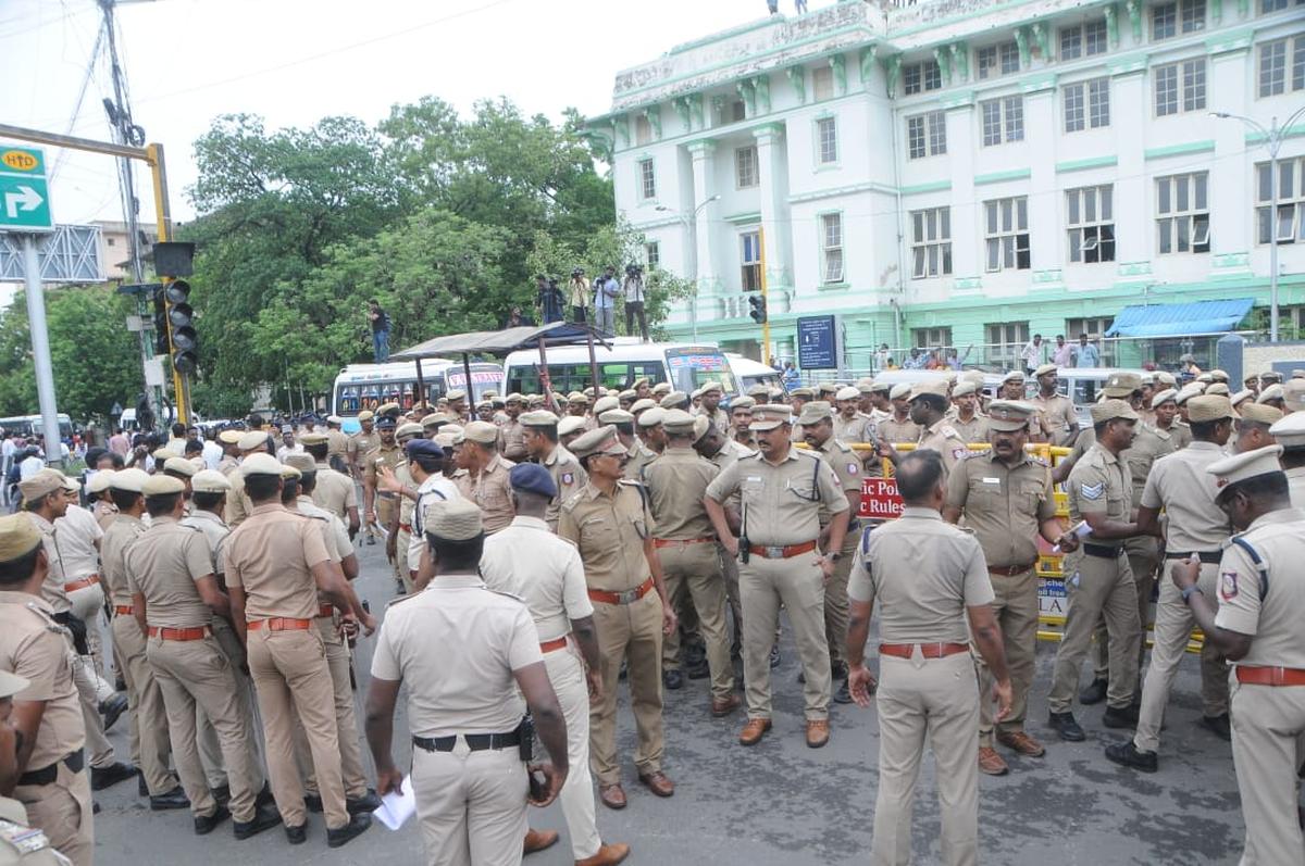 A large posse of police personnel posted near the Rajiv Gandhi Government General Hospital in Chennai where supporters of murdered BSP leader K. Armstrong staged a protest