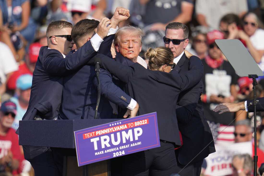 Former President Donald Trump is rushed offstage during a rally in in Butler, Pa.