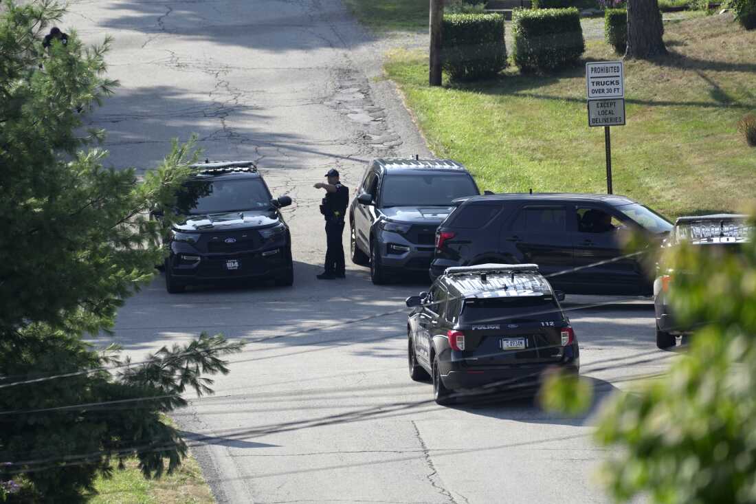 Law enforcement block a street in Bethel Park, Pa., that they say was a residence of Thomas Matthew Crooks, the suspected shooter of former President Donald Trump, Sunday, July 14, 2024.