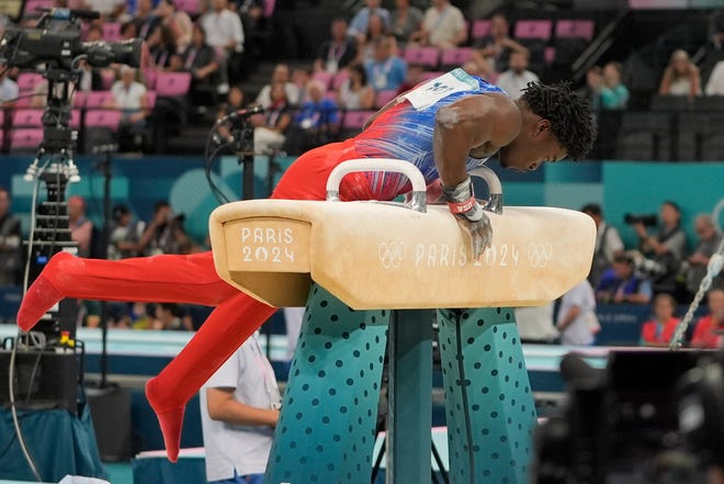 July 31, 2024; Paris, FRANCE; Frederick Richard (USA) falls while competing on the pommel horse in the men's all-around gymnastics final during the Paris 2024 Olympic Summer Games at Bercy Arena. Mandatory Credit: Jack Gruber-USA TODAY Sports