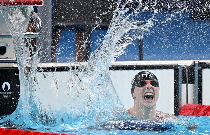 American swimmer Katie Ledecky celebrates after winning Olympic gold in the 1,500-meter freestyle on Wednesday, July 31. The American swimming legend <a href=