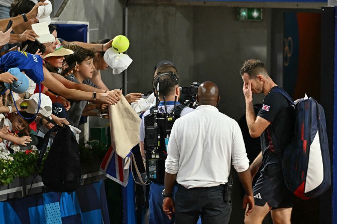 A tearful Andy Murray leaves the court after he and doubles partner Dan Evans <a href=