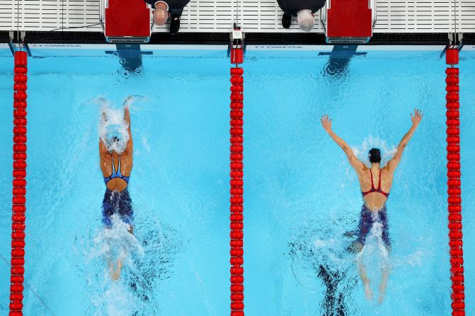 American swimmer Torri Huske, left, edges teammate Gretchen Walsh as they <a href=