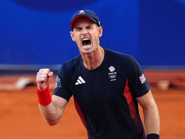 Great Britain’s Andy Murray reacts after he and doubles partner Dan Evans came back to defeat Japan’s Taro Daniel and Kei Nishikori in a second-round match at the Olympics on July 28. <a href=