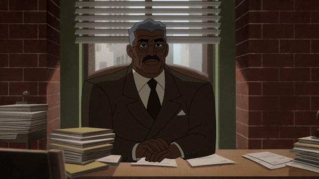 Commissioner Jim Gordon in 'Batman: Caped Crusader,' shown here sitting behind a desk stacked with files