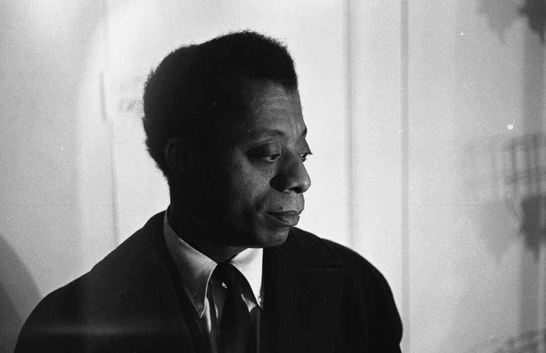 American author and playwright James Baldwin as he sits backstage at the American National Theater and Academy Playhouse in New York, New York, April 1964. He was there to attend the opening of his play 'Blues for Mr Charlie.'