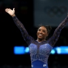 Simone Biles reacts after the balance beam portion of the women's gymnastics individual all-around competition at the Paris Olympics on Thursday. She's now won six Olympic gold medals — the most of any U.S. gymnast.