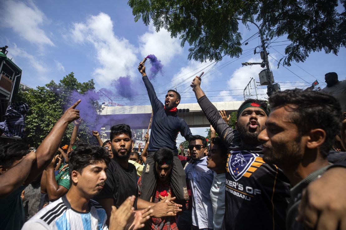 Protesters shout slogans as they celebrate Prime Minister Sheikh Hasina's resignation in Dhaka.